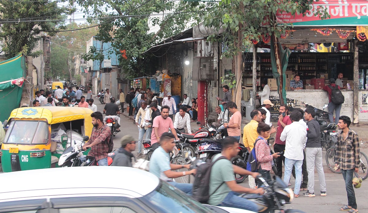 People arriving at liquor shops parking vehicle outside at Bengali Square 